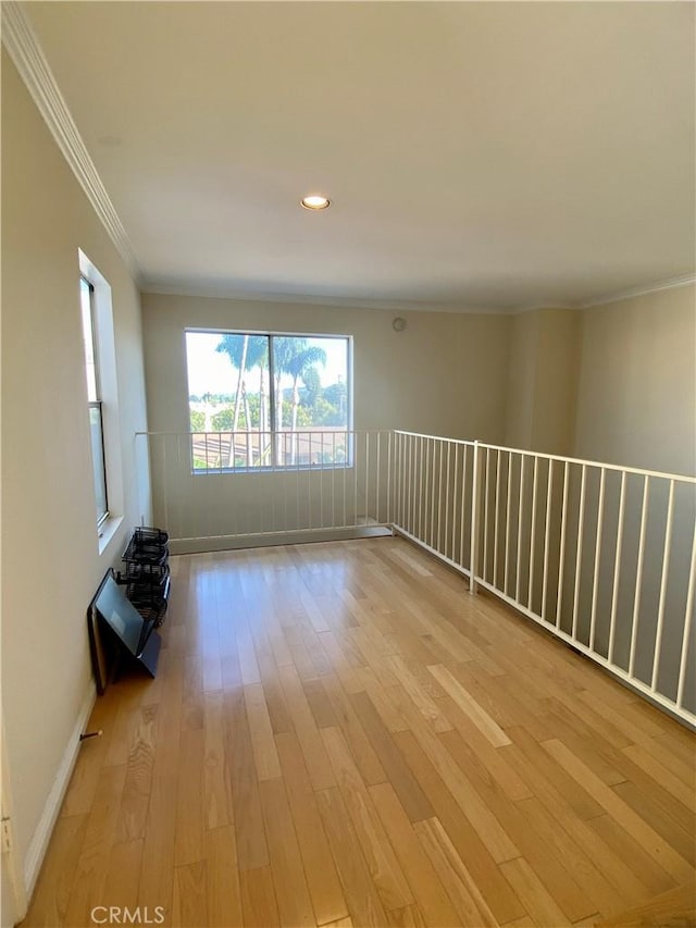14919 Dickens St Unit 105, Sherman Oaks, CA 91403 - empty room featuring crown molding, light wood finished floors, and baseboards