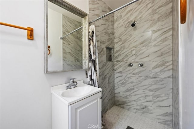 bathroom with a stall shower and vanity