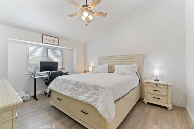 bedroom with light wood-style floors, baseboards, vaulted ceiling, a ceiling fan, and an office area