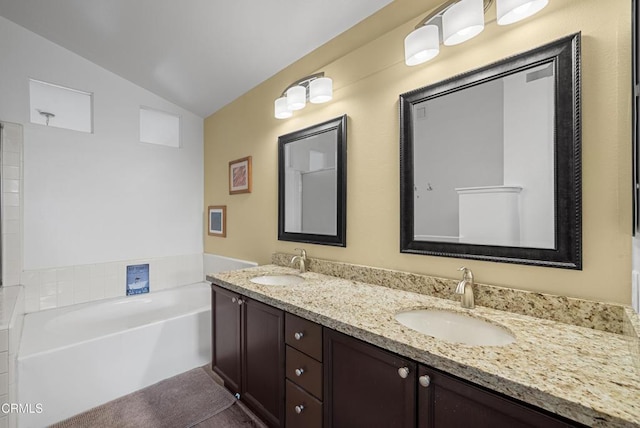1219 Lost Point Ln, Oxnard, CA 93030 - bathroom featuring lofted ceiling, a bath, and double vanity
