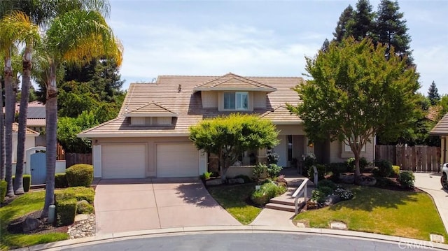 3384 Locksley Ct, Merced, CA 95340 - view of front facade with driveway, a garage, a tiled roof, and stucco siding