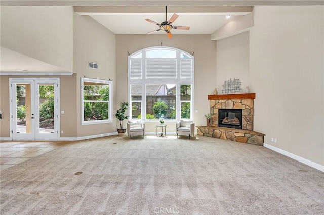 3384 Locksley Ct, Merced, CA 95340 - carpeted living area featuring a towering ceiling, baseboards, a fireplace, a ceiling fan, and tile patterned floors