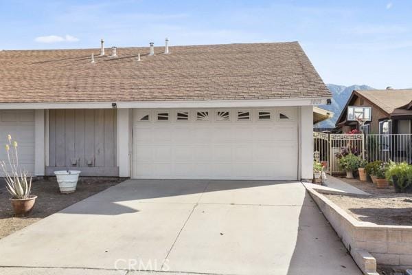 3805 Eisenhower Dr, Lake Elsinore, CA 92530 - garage featuring fence and concrete driveway