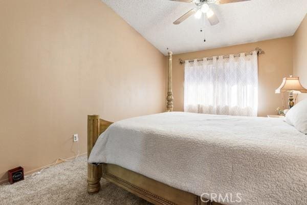 3805 Eisenhower Dr, Lake Elsinore, CA 92530 - bedroom featuring carpet floors, lofted ceiling, and ceiling fan