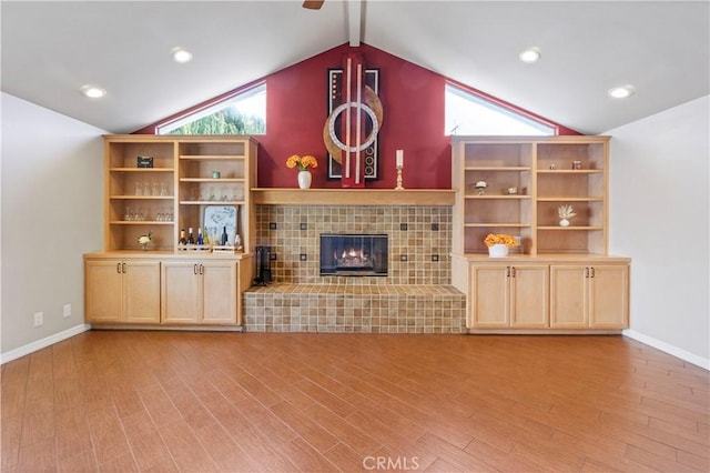 1879 N Nordic Pl, Orange, CA 92865 - unfurnished living room featuring light wood-type flooring, a fireplace, baseboards, and a ceiling fan