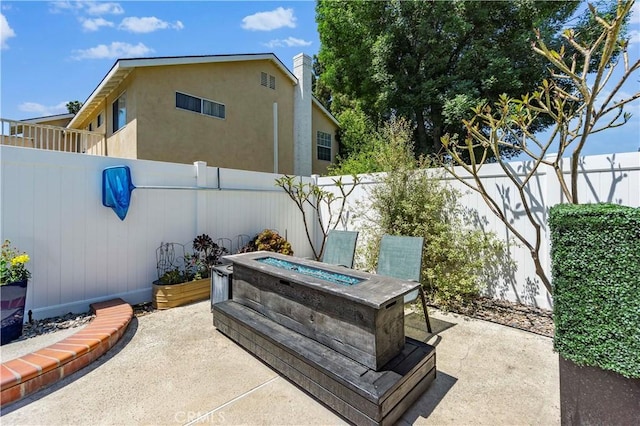 1879 N Nordic Pl, Orange, CA 92865 - fenced backyard with a patio area and an outdoor fire pit