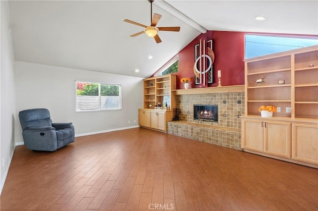 1879 N Nordic Pl, Orange, CA 92865 - unfurnished living room featuring a ceiling fan, wood finished floors, a fireplace, and baseboards