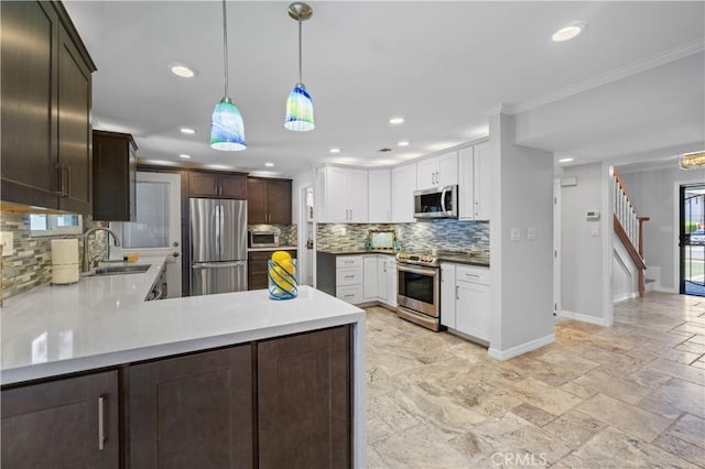 1879 N Nordic Pl, Orange, CA 92865 - kitchen with stainless steel appliances, a sink, decorative backsplash, baseboards, and recessed lighting