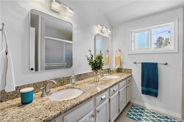 1879 N Nordic Pl, Orange, CA 92865 - full bathroom featuring double vanity, a stall shower, lofted ceiling, baseboards, and tile patterned floors