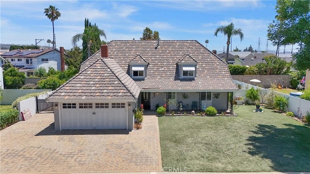 1879 N Nordic Pl, Orange, CA 92865 - view of front facade with decorative driveway, an attached garage, and a porch