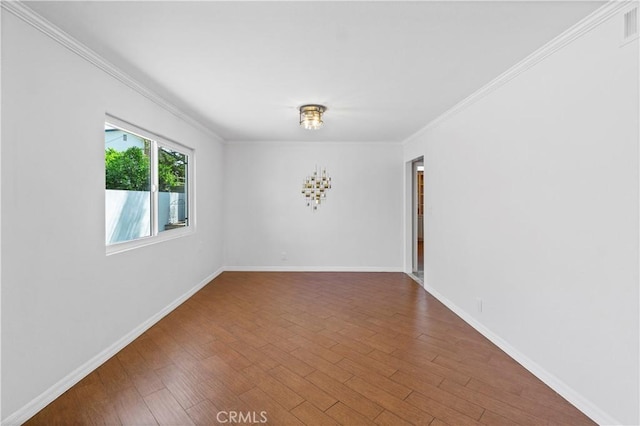 1879 N Nordic Pl, Orange, CA 92865 - empty room with crown molding, wood finished floors, and baseboards