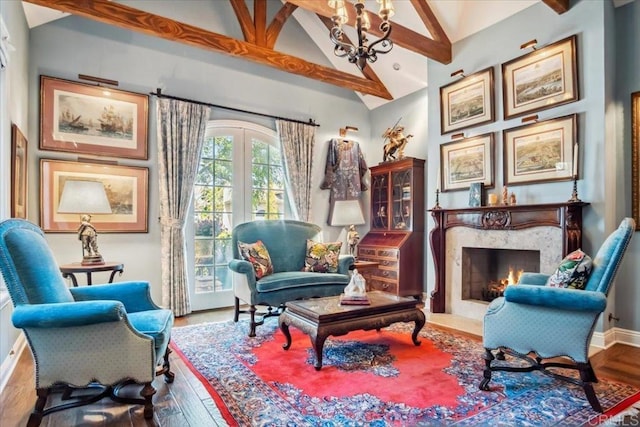 16056 Avenida Calma, Rancho Santa Fe, CA 92091 - sitting room featuring wood finished floors, a chandelier, a high end fireplace, and high vaulted ceiling