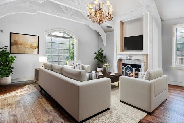 16056 Avenida Calma, Rancho Santa Fe, CA 92091 - living room with vaulted ceiling, a chandelier, hardwood / wood-style flooring, and a large fireplace