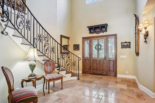 16056 Avenida Calma, Rancho Santa Fe, CA 92091 - foyer entrance featuring stone tile floors, a high ceiling, and stairway