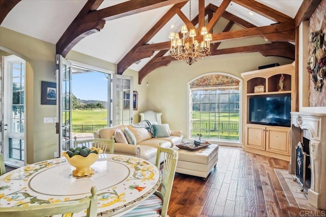 16056 Avenida Calma, Rancho Santa Fe, CA 92091 - living area featuring a chandelier, hardwood / wood-style flooring, a fireplace, and arched walkways