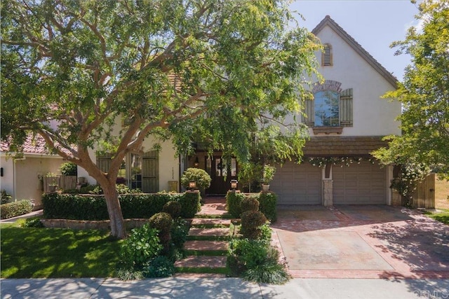 16056 Avenida Calma, Rancho Santa Fe, CA 92091 - view of front facade with stucco siding, concrete driveway, and an attached garage