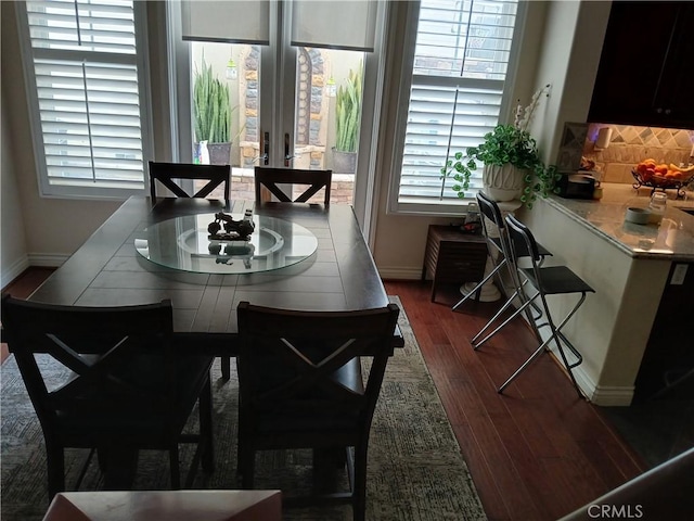 2520 Cornerstone Ln, Costa Mesa, CA 92626 - dining room with french doors, dark wood finished floors, and baseboards