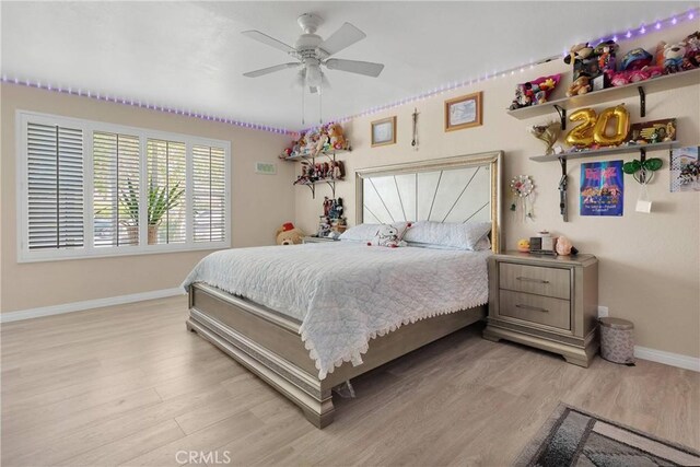 18060 Pebble Beach Dr, Victorville, CA 92395 - bedroom featuring baseboards, light wood-style floors, and ceiling fan