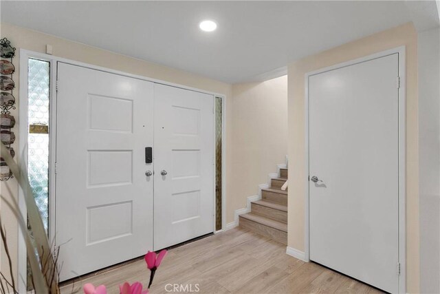 18060 Pebble Beach Dr, Victorville, CA 92395 - entrance foyer with light wood-type flooring, stairs, baseboards, and recessed lighting