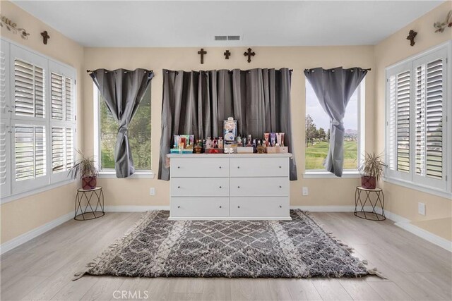 18060 Pebble Beach Dr, Victorville, CA 92395 - bedroom with wood finished floors, multiple windows, and baseboards