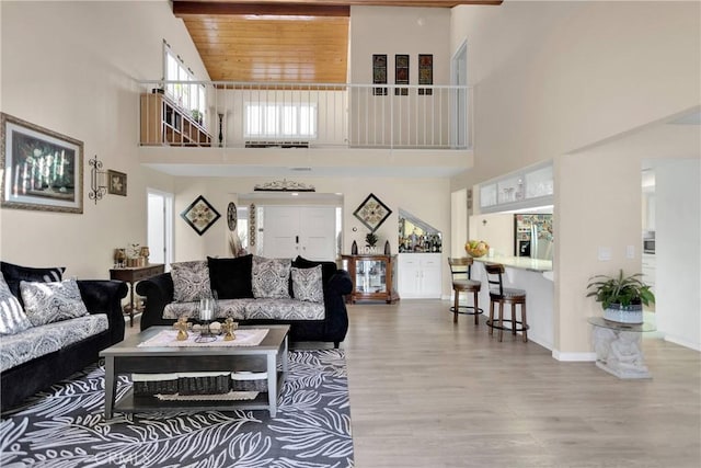 18060 Pebble Beach Dr, Victorville, CA 92395 - living area with high vaulted ceiling, wood finished floors, baseboards, and wooden ceiling
