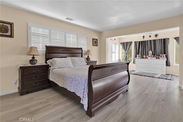 18060 Pebble Beach Dr, Victorville, CA 92395 - bedroom featuring wood finished floors and baseboards
