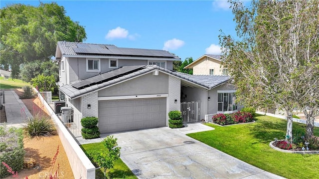 18060 Pebble Beach Dr, Victorville, CA 92395 - traditional-style house featuring roof mounted solar panels, a gate, brick siding, and concrete driveway