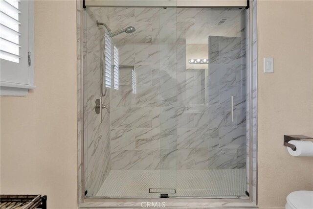 18060 Pebble Beach Dr, Victorville, CA 92395 - full bath featuring toilet and a marble finish shower
