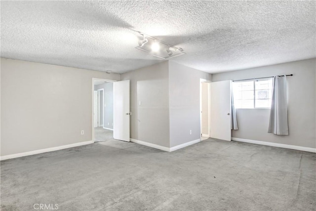 615 S Hewitt St, San Jacinto, CA 92583 - empty room featuring carpet floors and a textured ceiling