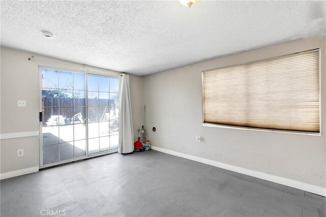 615 S Hewitt St, San Jacinto, CA 92583 - unfurnished room featuring a textured ceiling and baseboards