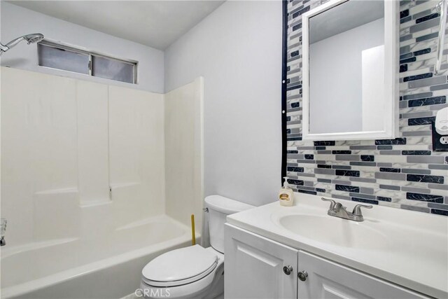615 S Hewitt St, San Jacinto, CA 92583 - bathroom with tasteful backsplash, vanity, and shower / tub combination