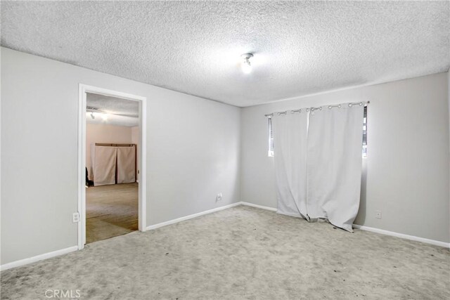 615 S Hewitt St, San Jacinto, CA 92583 - empty room with carpet floors and a textured ceiling