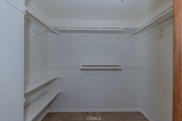 spacious closet with tile patterned flooring