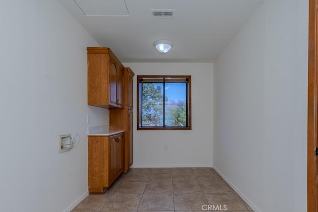 1717 W Columbia St, Long Beach, CA 90810 - washroom with hookup for a washing machine, baseboards, and cabinet space