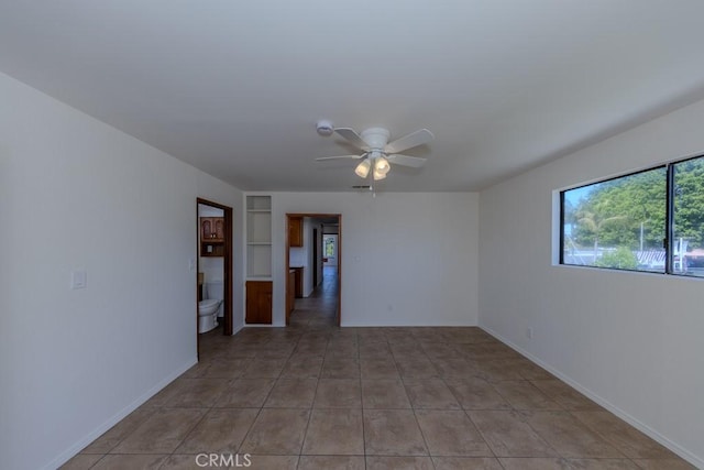 1717 W Columbia St, Long Beach, CA 90810 - spare room with ceiling fan, a smoke detector, baseboards, and light tile patterned flooring