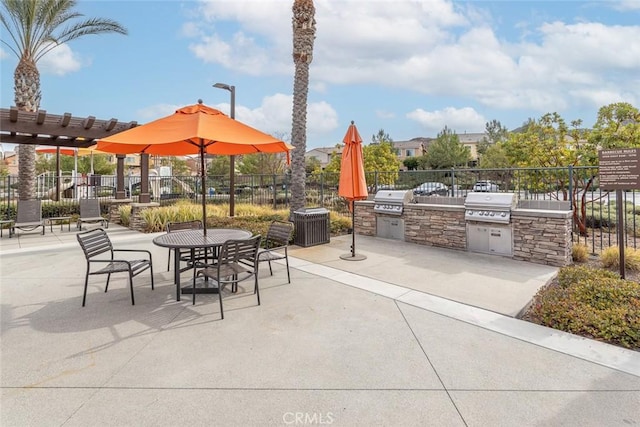 24449 Payton Dr, Lake Elsinore, CA 92532 - view of patio with an outdoor kitchen, a grill, fence, and a pergola