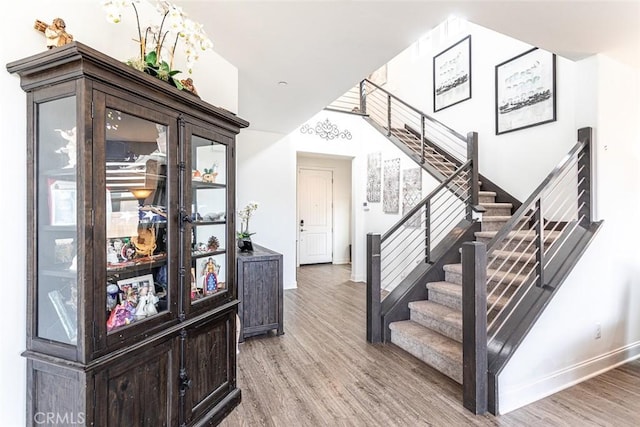 24449 Payton Dr, Lake Elsinore, CA 92532 - entrance foyer featuring stairway, wood finished floors, and baseboards