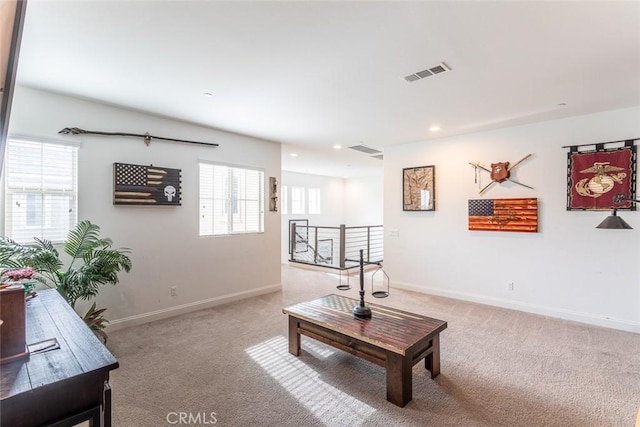 24449 Payton Dr, Lake Elsinore, CA 92532 - living area with light carpet, healthy amount of natural light, baseboards, and recessed lighting
