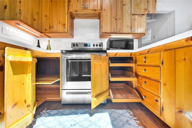 771 Woodland Rd, Crestline, CA 92325 - kitchen with electric range, black microwave, dark wood-style floors, backsplash, and light countertops