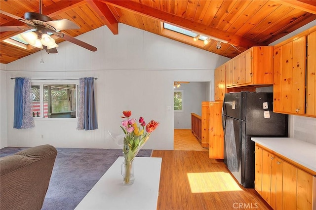771 Woodland Rd, Crestline, CA 92325 - kitchen featuring freestanding refrigerator, a skylight, healthy amount of natural light, and wood ceiling
