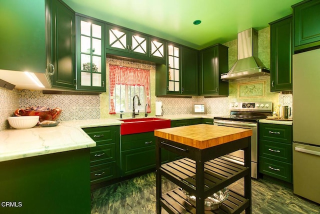 11 N San Gabriel Canyon Rd, Azusa, CA 91702 - kitchen with green cabinetry and wall chimney range hood