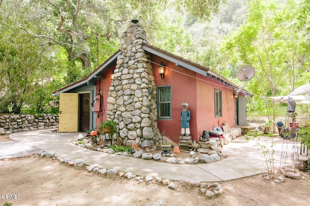 11 N San Gabriel Canyon Rd, Azusa, CA 91702 - view of side of property featuring a chimney