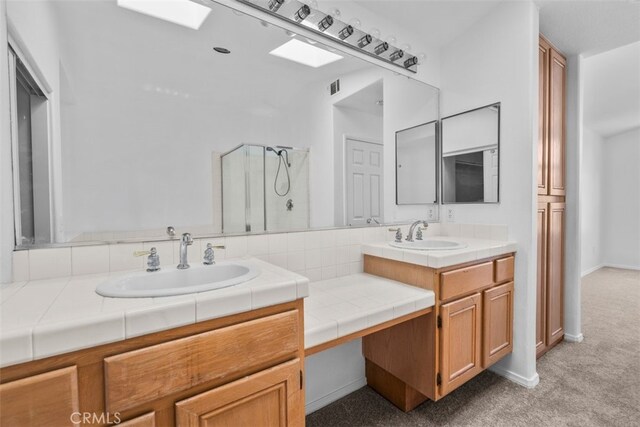 14726 Burgundy Pl, Chino Hills, CA 91709 - full bathroom with double vanity, a skylight, and a shower