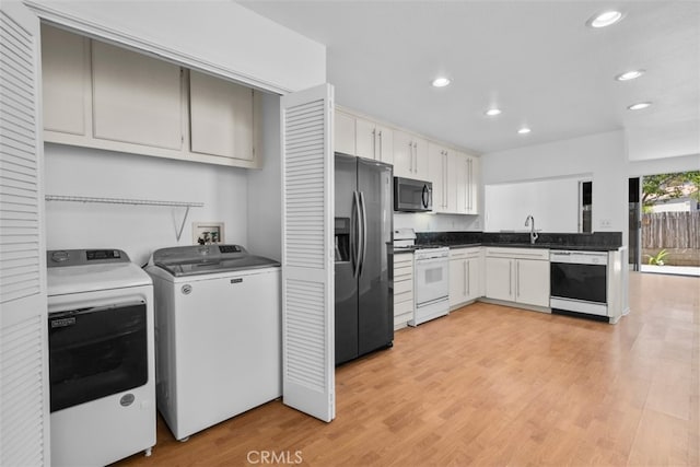 14726 Burgundy Pl, Chino Hills, CA 91709 - kitchen featuring appliances with stainless steel finishes, recessed lighting, a sink, washer and dryer, and light wood-style flooring