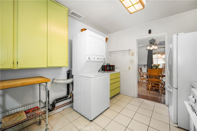 14512 Lefloss Ave, Norwalk, CA 90650 - laundry room featuring estacked washer and dryer, light tile patterned flooring, and ceiling fan