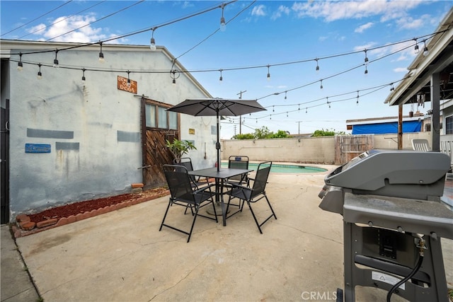 14512 Lefloss Ave, Norwalk, CA 90650 - fenced backyard with a patio area, outdoor dining area, and grilling area