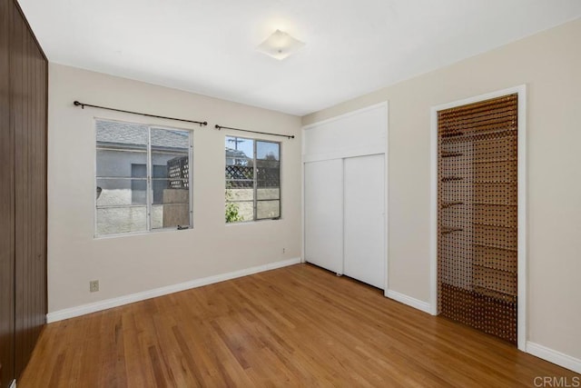 3973 69th St, San Diego, CA 92115 - unfurnished bedroom featuring light wood-type flooring, baseboards, a closet, and ensuite bath