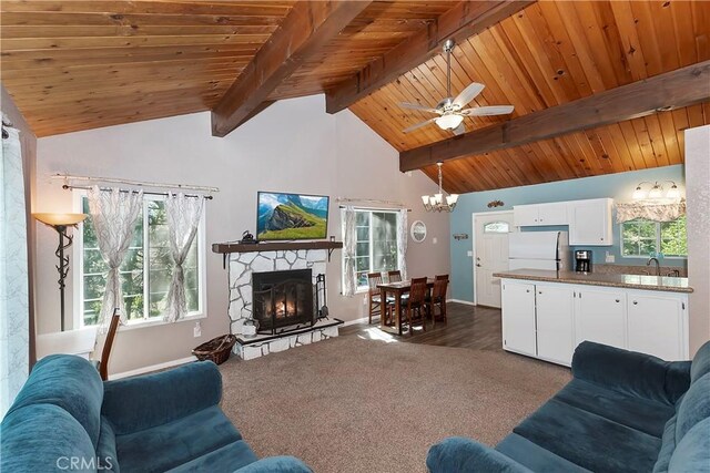 22365 Pine Dr, Cedarpines Park, CA 92322 - living area with wooden ceiling, baseboards, plenty of natural light, beamed ceiling, and ceiling fan