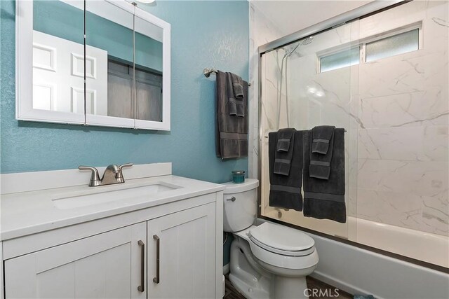 22365 Pine Dr, Cedarpines Park, CA 92322 - full bath with toilet, vanity, combined bath / shower with glass door, and a textured wall