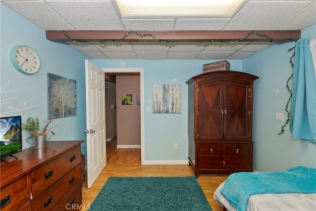 22365 Pine Dr, Cedarpines Park, CA 92322 - bedroom with a paneled ceiling, light wood finished floors, and baseboards